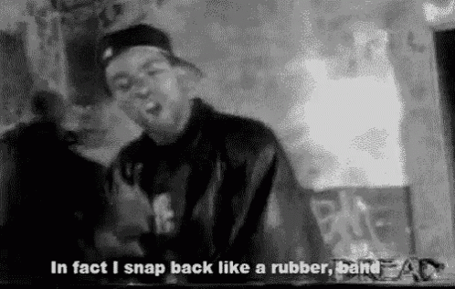 A Black And White Photo Of A Man With The Words `` In Fact I Snap Back Like A Rubber Band '' Written Below Him . GIF