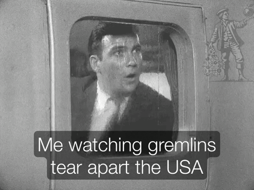A Black And White Photo Of A Man With The Words Me Watching Gremlins Tear Apart The Usa GIF