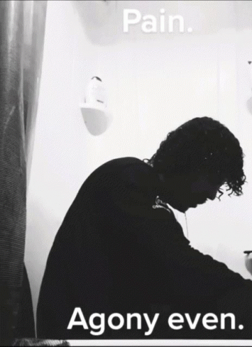 A Black And White Photo Of A Man With The Words Pain Agony Even Below Him GIF