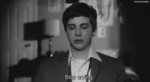 A Black And White Photo Of A Man With The Words Stop Crying GIF