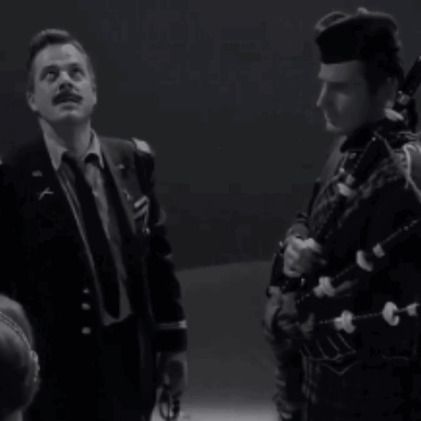 A Black And White Photo Of A Man With The Words We Are In Hell GIF