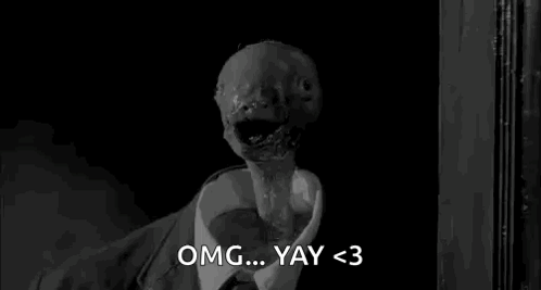 A Black And White Photo Of A Monster In A Suit And Tie Saying Omg ... Yay < 3 . GIF