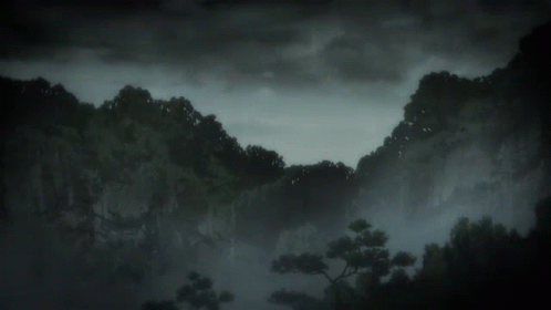 A Black And White Photo Of A Mountain Range With Trees GIF