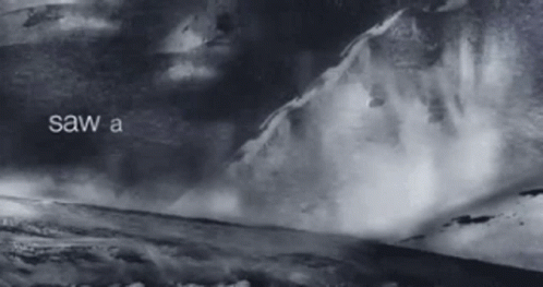 A Black And White Photo Of A Mountain With The Words Saw A Below It GIF