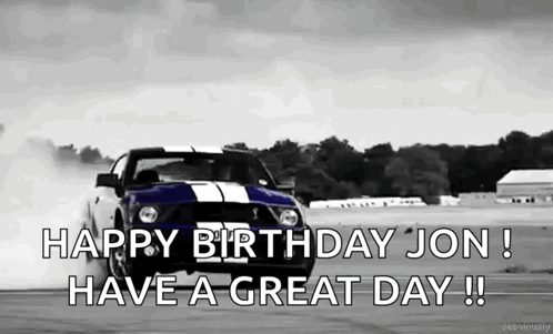 A Black And White Photo Of A Mustang Drifting On A Race Track . GIF