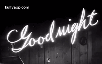 A Black And White Photo Of A Neon Sign That Says Good Night . GIF