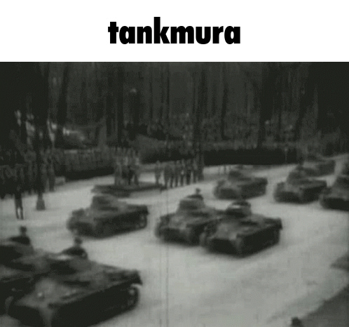 A Black And White Photo Of A Parade Of Tanks With The Words Tankmura Above It GIF