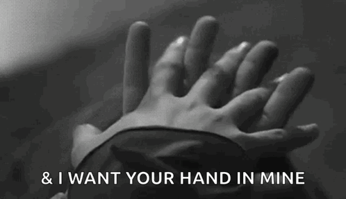 A Black And White Photo Of A Person Holding Another Person 'S Hand With The Words " And I Want Your Hand In Mine " Above GIF