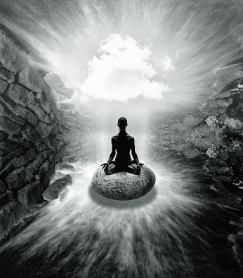 A Black And White Photo Of A Person Meditating On A Large Rock GIF
