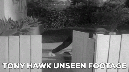 A Black And White Photo Of A Person Opening A Gate With The Words Tony Hawk Unseen Footage Below It GIF