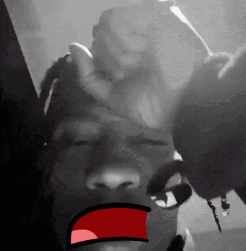 A Black And White Photo Of A Person 'S Face With A Cartoon Mouth . GIF
