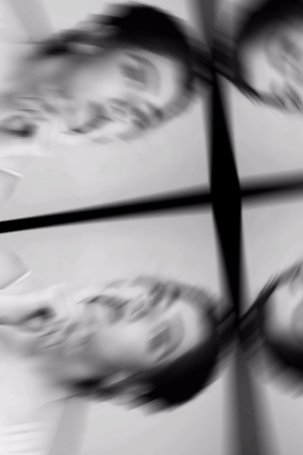 A Black And White Photo Of A Person 'S Face With A Reflection GIF