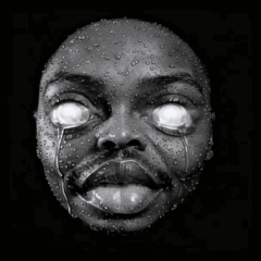 A Black And White Photo Of A Person 'S Face With Water Drops On It GIF