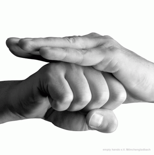 A Black And White Photo Of A Person 'S Hands With The Caption Empty Hands E.v. GIF