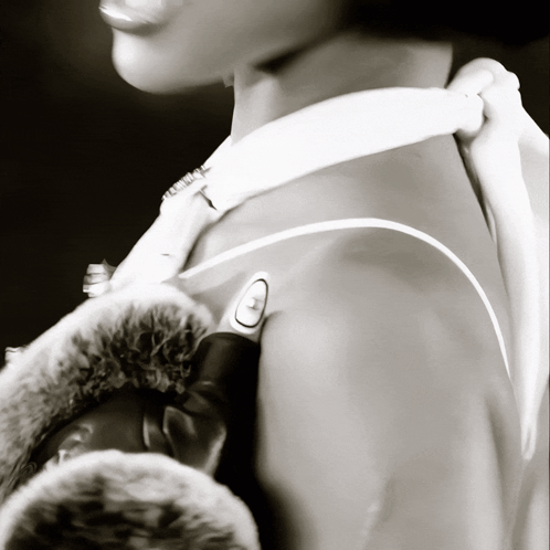 A Black And White Photo Of A Person 'S Shoulder GIF