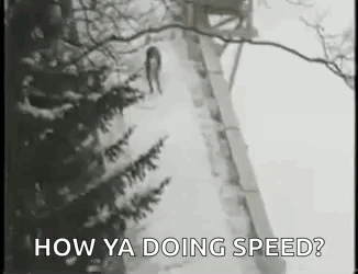 A Black And White Photo Of A Person Walking Down A Snowy Path . GIF