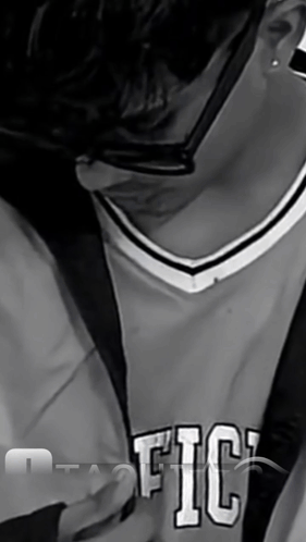 A Black And White Photo Of A Person Wearing A Jersey That Says Fic GIF