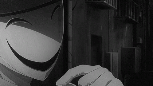 A Black And White Photo Of A Person Wearing A Mask With A Smiley Face . GIF