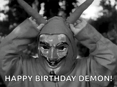 A Black And White Photo Of A Person Wearing A Mask With The Words Happy Birthday Demon Below It GIF