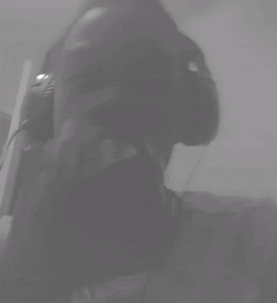A Black And White Photo Of A Person Wearing Headphones With Their Eyes Closed GIF