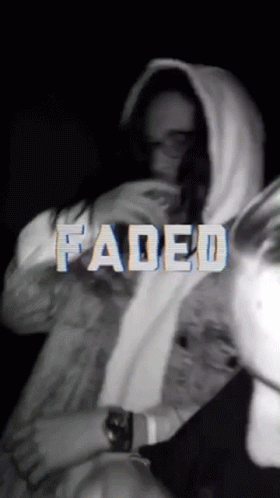 A Black And White Photo Of A Person With Faded Written In White Letters GIF