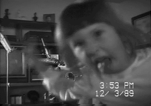 A Black And White Photo Of A Person With The Time Of 3:53 Pm On The Bottom GIF