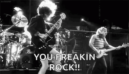A Black And White Photo Of A Rock Band With The Words You Freakin Rock Written In The Corner GIF