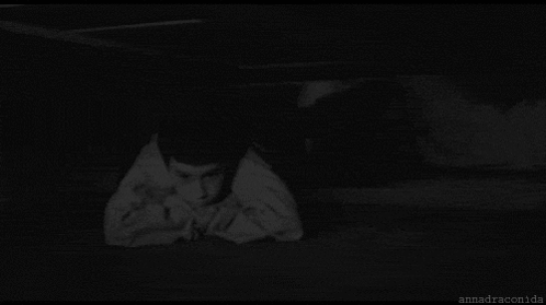A Black And White Photo Of A Scary Clown With A Huge Mouth GIF