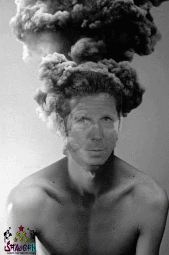 A Black And White Photo Of A Shirtless Man With Smoke Coming From His Head GIF