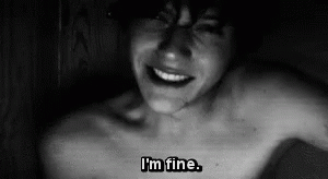 A Black And White Photo Of A Shirtless Man With The Words `` I 'M Fine '' Written On His Chest . GIF