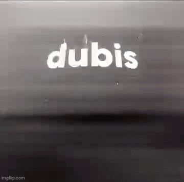 A Black And White Photo Of A Sign That Says Dubis . GIF