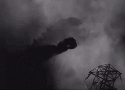 A Black And White Photo Of A Smoke Coming Out Of A Building . GIF