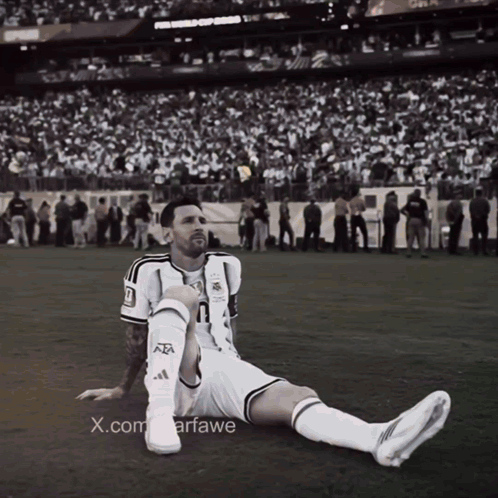 A Black And White Photo Of A Soccer Player With The X.com Watermark GIF