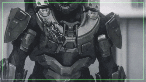 A Black And White Photo Of A Soldier With A Green Border Around It GIF