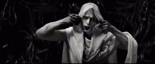 A Black And White Photo Of A Statue Of A Man Wrapped In A Cloth . GIF