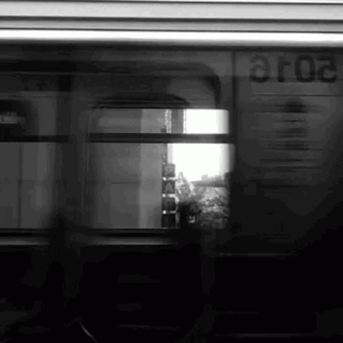 A Black And White Photo Of A Train With The Number Aro2 On The Side GIF