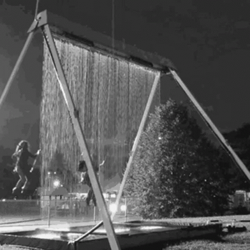 A Black And White Photo Of A Water Curtain GIF