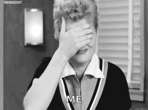 A Black And White Photo Of A Woman Covering Her Face With Her Hand And The Words `` Me '' . GIF
