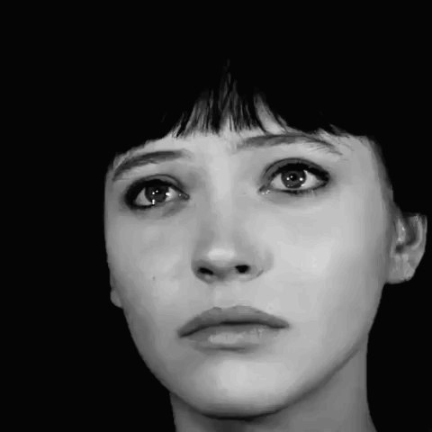 A Black And White Photo Of A Woman Crying With Tears Coming Out Of Her Eyes . GIF
