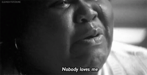 A Black And White Photo Of A Woman Crying With The Words `` Nobody Loves Me '' Written On The Bottom . GIF