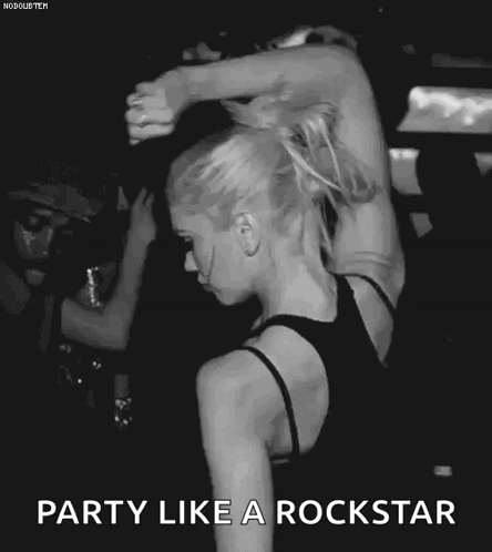 A Black And White Photo Of A Woman Dancing In A Crowd With The Words Party Like A Rockstar . GIF