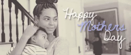 a black and white photo of a woman holding a baby with the words happy mothers day written on it