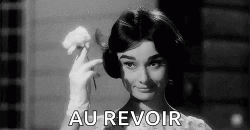 A Black And White Photo Of A Woman Holding A Flower And The Words `` Au Revoir '' . GIF