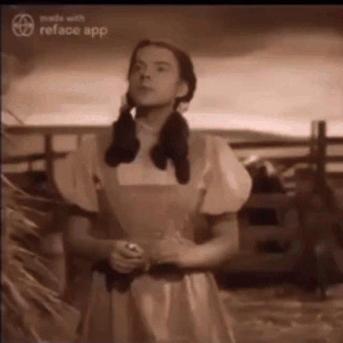 A Black And White Photo Of A Woman In A Yellow Dress GIF