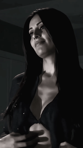 A Black And White Photo Of A Woman In Lingerie GIF