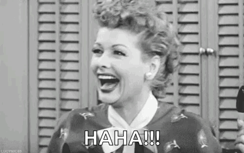 A Black And White Photo Of A Woman Laughing In Front Of A Locker Room . GIF