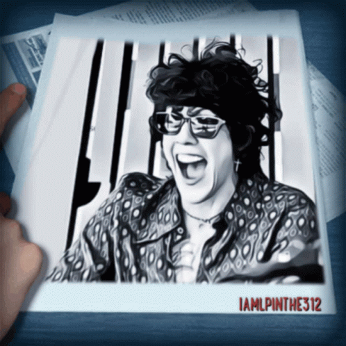 A Black And White Photo Of A Woman Laughing With The Name Iamlpinthe312 On The Bottom GIF