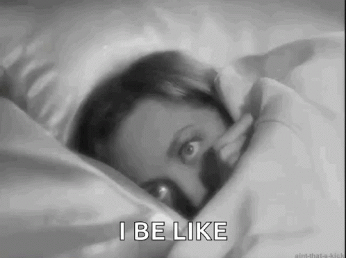 A Black And White Photo Of A Woman Laying In Bed With The Words I Be Like . GIF