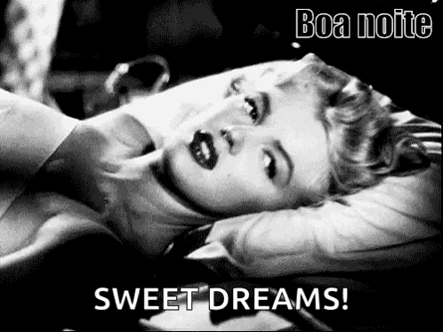A Black And White Photo Of A Woman Laying On A Bed With The Words `` Sweet Dreams '' Written On The Bottom . GIF