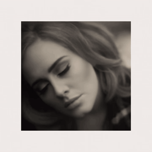 A Black And White Photo Of A Woman Looking Down GIF